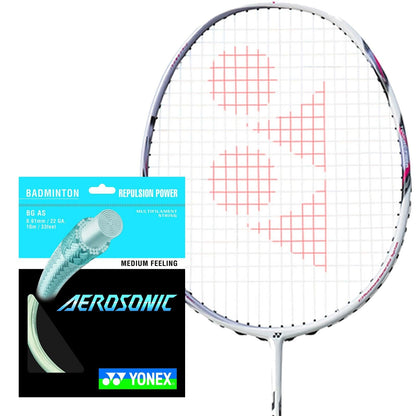 The image shows a Yonex badminton racket with red strings forming a logo, alongside a packet of Yonex Aerosonic Badminton String in white, with a gauge of 0.61mm and 10 meters in length. The packaging, designed in striking blue and black, emphasizes features such as "Repulsion Power" and "Medium Feeling.