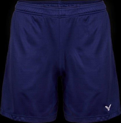 Introducing the Victor Team Line Unisex Badminton Shorts R-03200 B - Blue by Victor: These navy blue shorts are crafted from stretchable material, equipped with an elastic waistband for comfort. A small white logo adorns the lower left, and their lightweight design boasts a smooth, slightly shiny finish. The sleek design is emphasized by the dark background color.