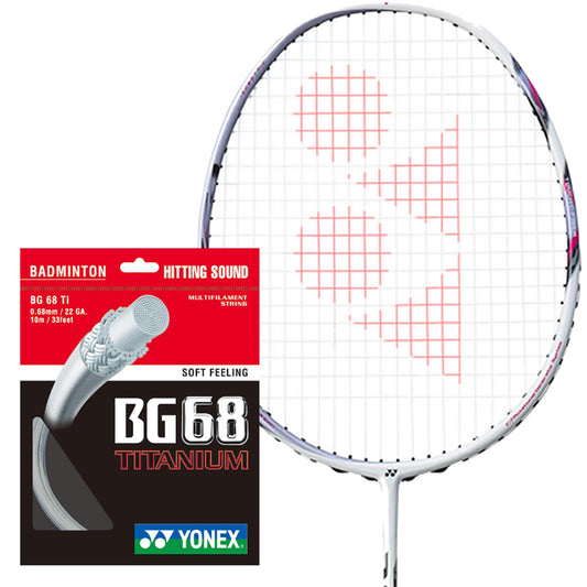 A Yonex badminton racket equipped with red strings showcasing the brand's signature logo design. Next to it, there's a package of Yonex BG 68 Ti Badminton Strings in white, boasting an ultra-thin 0.68mm gauge with a hydro titanium coating, and labeled "Soft Feeling" and "Hitting Sound". The packaging predominantly features black and red colors alongside detailed product information.