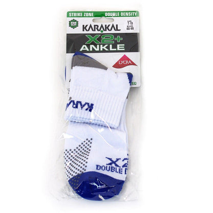 The packaging of the Karakal X2+ Mens Technical Ankle Badminton Socks highlights a folded pair of white and navy socks designed with shock-absorbing, double-density cushioning. Accentuated with grey and blue details, they are suitable for sizes UK 7-13 / Euro 40-48.