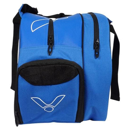 The Victor Multithermo 9031 Badminton Bag - Blue is a sporty blue and black backpack tailored for racket sports. It includes several zippered compartments, such as a dedicated shoe compartment, and features a white Victor logo on the front. The bag offers versatile usage with both a carry handle and shoulder straps.