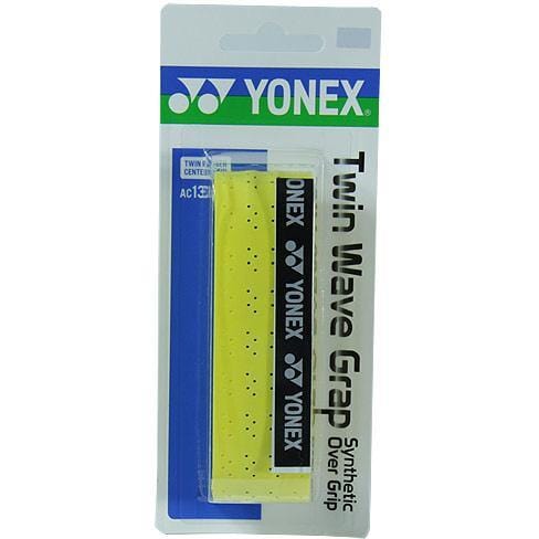 The Yonex AC139EX Twin Wave Grap Badminton Overgrip in yellow is distinguished by its tacky feel, making it ideal for upgrading your badminton racket. It is presented in a clear plastic package with a blue and white Yonex-branded cardboard backing that highlights the twin rubber strip design.