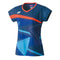 This Yonex 20521 Women's T-Shirt in Indigo Blue is an athletic shirt with short sleeves and an abstract design incorporating shades of blue and orange. It features an orange stripe across the chest, a small white logo on the left side, and a V-neck collar, making it perfect for high performance both on and off the court.