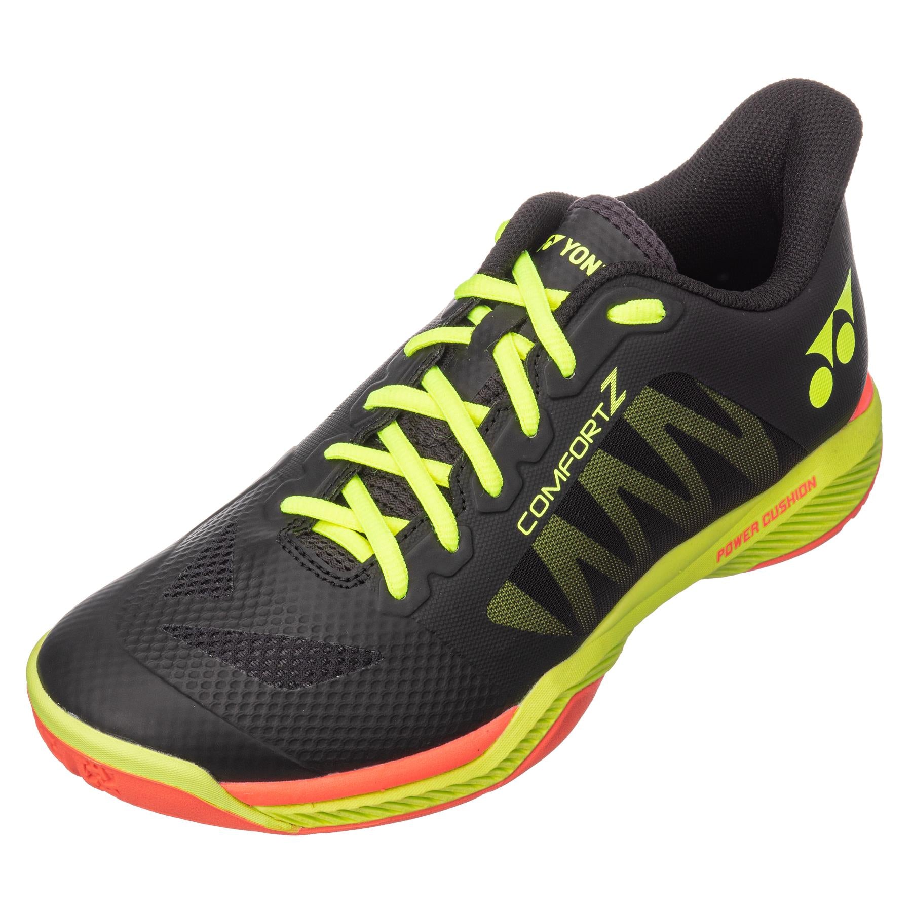 Introducing the Yonex Power Cushion Comfort Z3 Men's Badminton Shoes in black, accented with neon yellow and featuring lime green laces. These shoes incorporate Yonex's renowned Power Cushion technology to enhance comfort, and showcase red and yellow accents on the sole. The design is completed with branding elements like "Comfort Z" along with logos prominently displayed on the side and tongue.