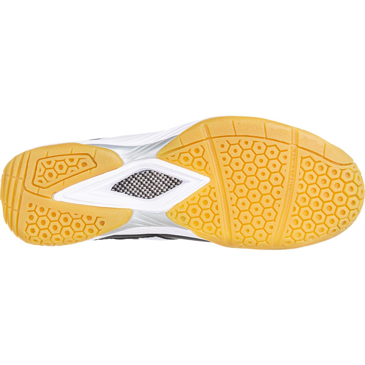 The image showcases the sole of the FZ Forza X-Pulse Men's Badminton Shoes in black and white, featuring a yellow honeycomb-patterned grip. The midsole's silver and black checkered design enhances both support and style, while Drylex technology ensures optimal breathability.