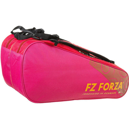 This elegant Persian Red FZ Forza Mia Blichfeldt Collab 6 Piece Badminton Racket Bag boasts black straps and gold lettering that reads "FZ Forza" and "Innovated in Denmark." Featuring a sleek floral design on the side, this bag seamlessly blends style with functionality.