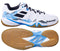 A pair of Babolat Shadow Spirit men's badminton shoes, highlighted by their Ortholite Die Cut insoles, comes in a sleek white design with black accents. The top shoe showcases a side view with laces, while the bottom shoe reveals a light brown rubber tread pattern. They're ideal for both tennis and badminton enthusiasts who prioritize comfort.