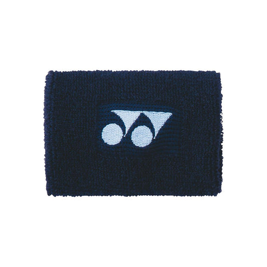 The Yonex AC46088 Sweat Wristband in Navy Blue displays a central blue geometric logo and is made from highly absorbent cotton for exceptional comfort.