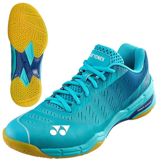 The Yonex Power Cushion Aerus X Men's Badminton Shoes in mint blue come with yellow soles and a breathable mesh design. These lightweight indoor court shoes incorporate Power Cushion technology for enhanced comfort, while the X-shaped sole and textured grip ensure optimal performance on the court.