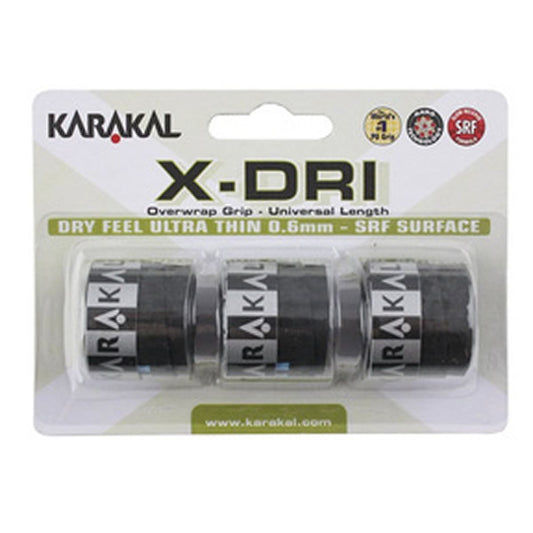 The packaging of the Karakal X-Dri Overwrap Badminton Grip - Black displays three rolls, with a label emphasizing "Dry Feel Ultra Thin 0.6mm - SRF Surface" for enhanced grip. It also includes the website www.karakal.com for more information.