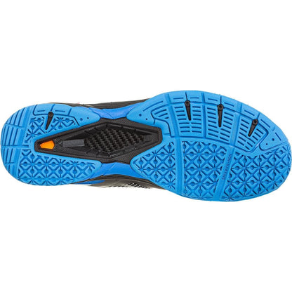 The image showcases the sole of the FZ Forza Brace Men's Badminton Shoes in an eye-catching black and blue color scheme. It features a detailed tread pattern, accented with black highlights and an orange logo near the heel, providing lateral support and exceptional shock absorption to enhance performance on the court.