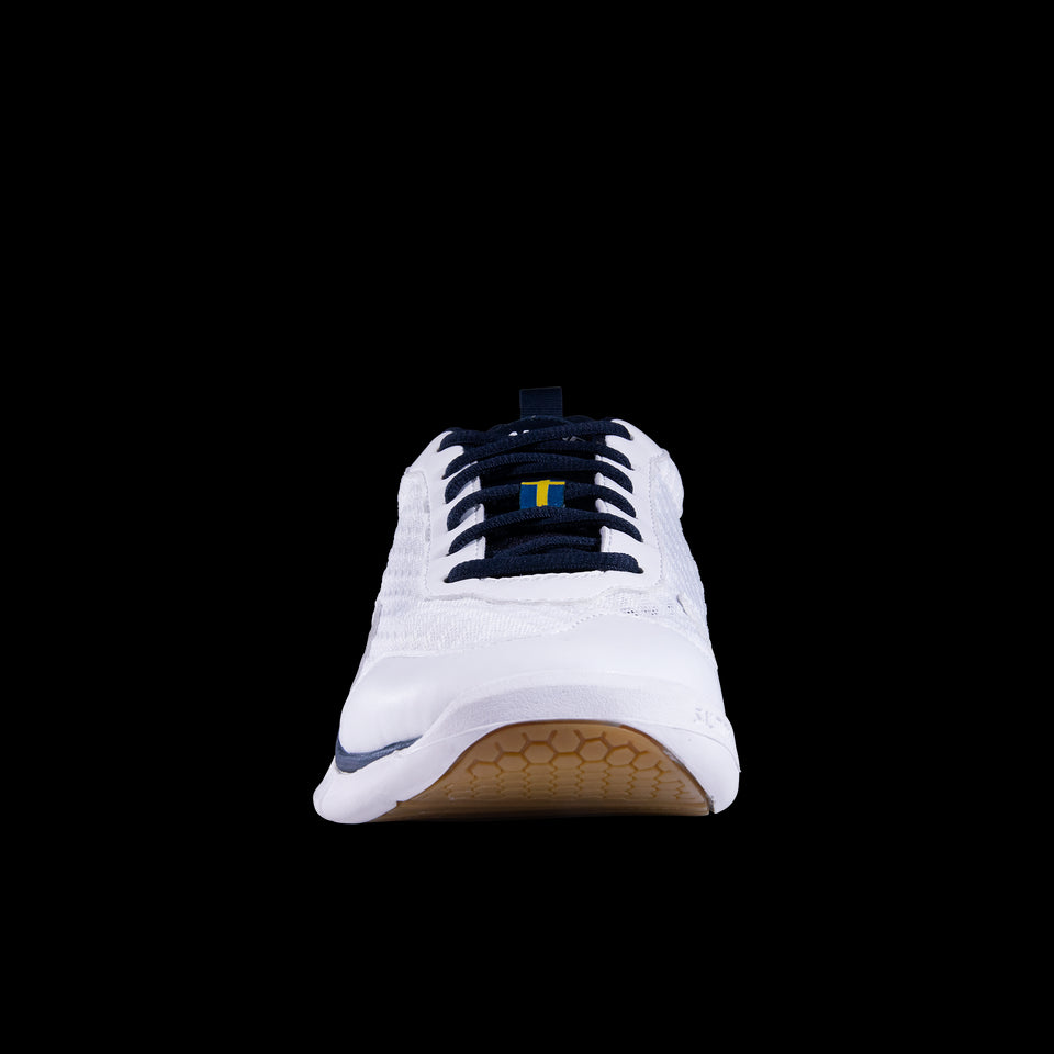 A front view of the Salming Viper SL Men's Badminton Shoes, known for their performance in badminton, showcases the sleek design of this white and navy athletic shoe. It is equipped with black laces and a unique honeycomb-patterned sole. Set against a solid black background, these lightweight court shoes combine style with functionality for optimal on-court performance.