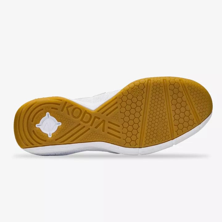 The image displays the sole of a Salming Kobra 3 Men's Badminton Shoe, characterized by a honeycomb pattern and diverse textures for superior grip, with added stability from an Ergo Heel Cup. The light brown sole features the "KOBRA" branding embossed near the heel, set against a white background that highlights the overall design.