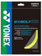 The image showcases a Yonex Exbolt 63 Badminton String pack in yellow, highlighting "Quick Repulsion" technology. It features FORGED FIBER for improved agility and comes with specifications of a 0.63 mm gauge and 10 m length, set against a dark background adorned with green and blue accents, proudly made in Japan.