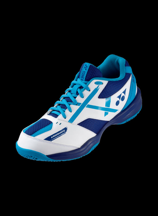 The Yonex Power Cushion 39 Junior Badminton Shoes in white and blue highlight a large Yonex logo on the side. They boast a black sole, complemented by blue accents on the laces and inner lining, all presented against a sleek black backdrop.