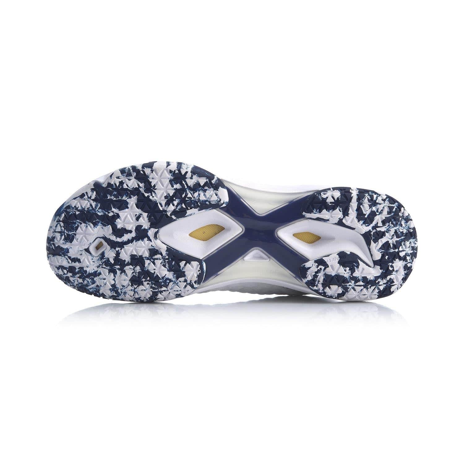 The image displays the sole of the Li-Ning Dagger II SE Men's Badminton Shoes - White. The design incorporates a rugged, patterned texture in a blend of blue and white colors, enhanced by TUFF-TIP durability. The center of the sole features small cutouts and a yellow section, enriched with Drive Foam for added comfort.