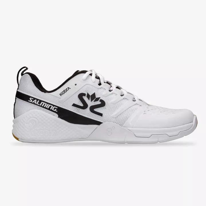 The Salming Kobra 3 Men's Badminton Shoes in white and black prominently display the brand name "SALMING" and "KOBRA" on the side. The shoe includes a logo on the tongue, a textured sole, and a loop on the back heel, all designed to enhance fit with an Ergo Heel Cup.