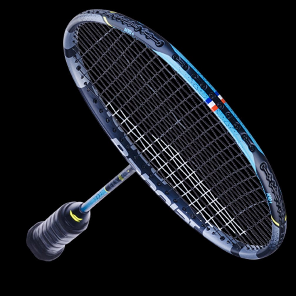 The Babolat Satelite Lite Badminton Racket - Blue, by Babolat, is showcased against a black background. Its frame features intricate design details and superior aerodynamics. The tightly strung strings and the dark grip on the handle work together to enhance both power and maneuverability.