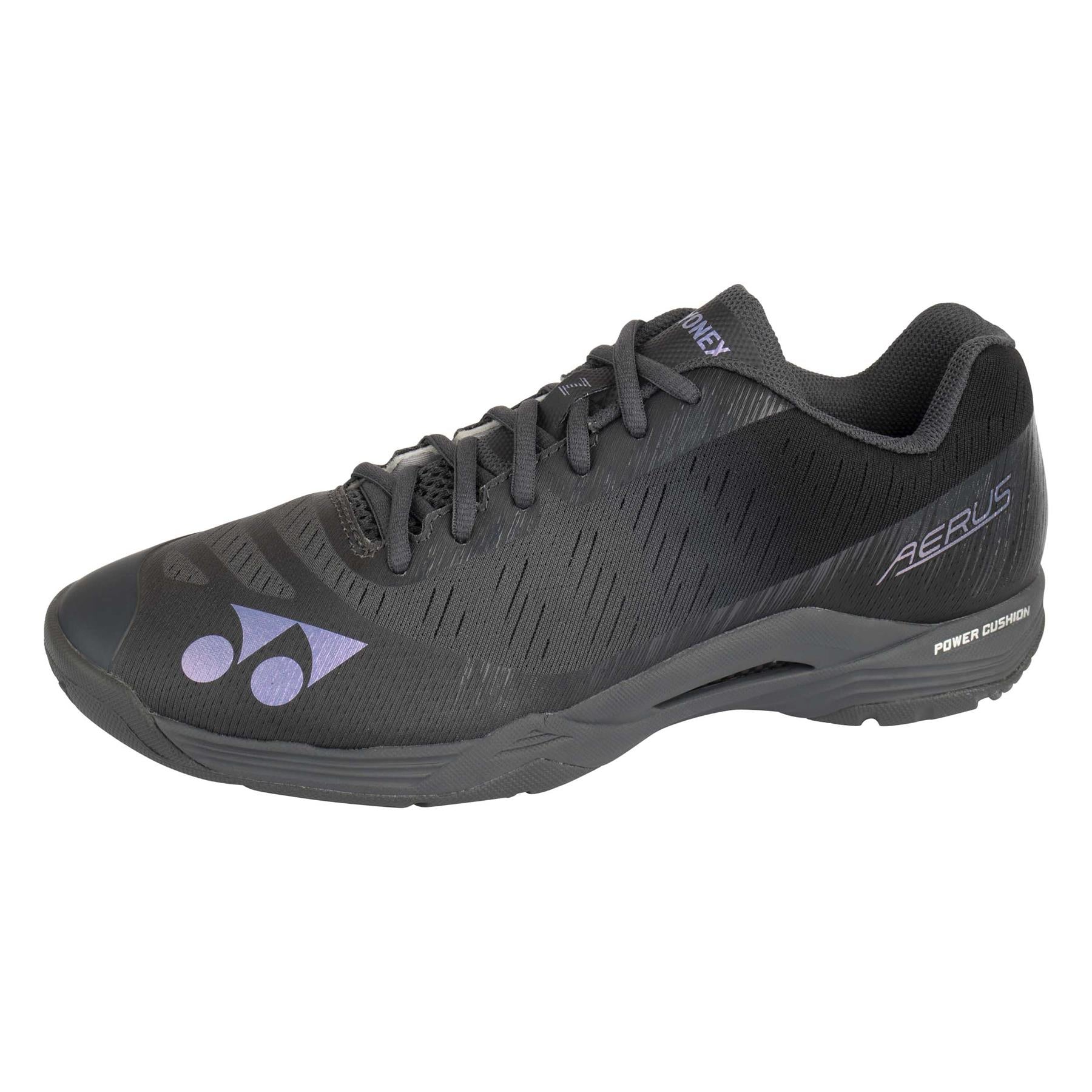 The Yonex Power Cushion Aerus Z men's badminton shoes in dark grey incorporate the brand's renowned Power Cushion technology. Adorned with delicate purple accents and a striking logo on the side, their textured patterns and "Aerus" label near the heel highlight their sleek design, specifically crafted for optimal badminton performance.