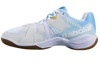 Side view of the Babolat Shadow Spirit 2023 Women's Badminton Shoes in white and light blue, featuring a gum rubber sole. These athletic shoes are enhanced with mesh panels, a lace-up design, and showcase the Babolat logo on the side. Experience superior comfort with the OrthoLite® Die Cut insole in these supportive shoes designed specifically for badminton.