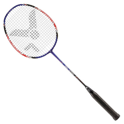 The Victor AL-3300 Badminton Racket by Victor boasts an aerodynamic frame with a striking blue and red design, complemented by a black grip. The strings create a unique triangular pattern at the center, displayed diagonally against a white backdrop.