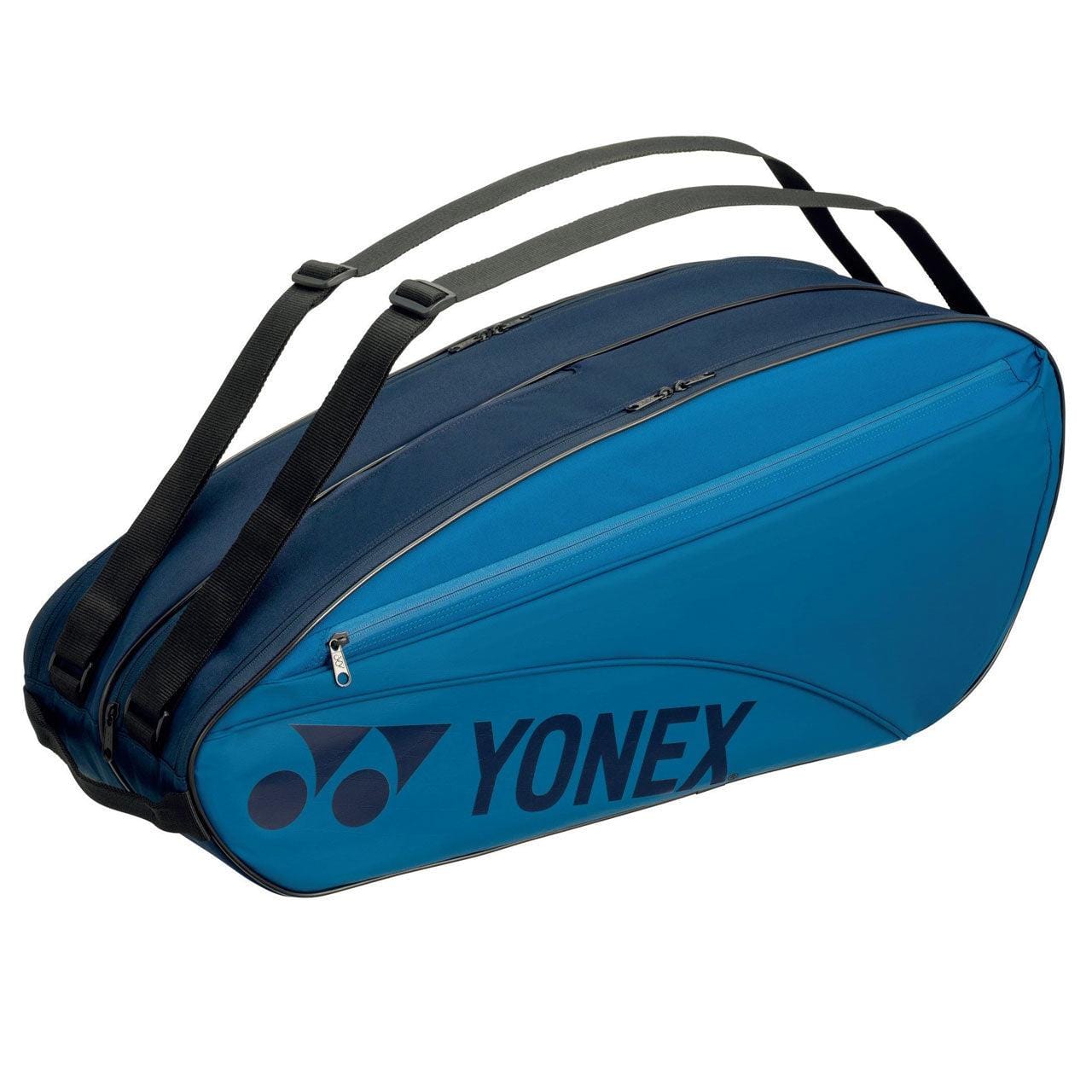 The Yonex 42326EX 6 Piece Racket Bag in Sky Blue offers adjustable shoulder straps and numerous zippered compartments, including a dedicated wet compartment for damp gear. The side prominently displays the Yonex logo, making it perfect for carrying all your tennis equipment with style.