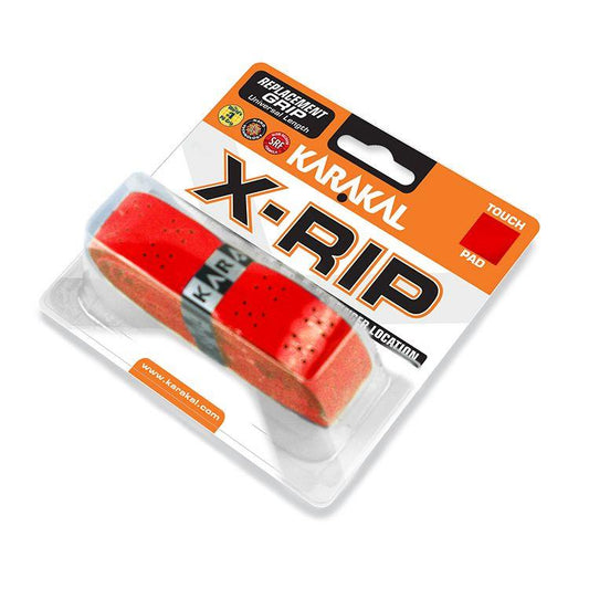 The Karakal X-RIP Replacement Badminton Grip in red is encased in clear plastic packaging that emphasizes its touch and pad features. It prominently displays the Karakal branding with icons for Long Life and replacement technology, includes usage recommendations, and features a breathable surface to boost performance.