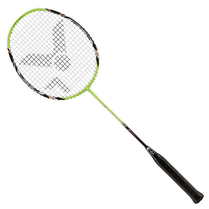 Introducing the Victor G-7000 Badminton Racket by Victor, a beginner's racket crafted entirely from carbon in vibrant green and black. This racket showcases a beautifully designed mesh string head with Ashaway Rally 21 Fire strings, complemented by a comfortable black grip handle, all displayed against a white background.