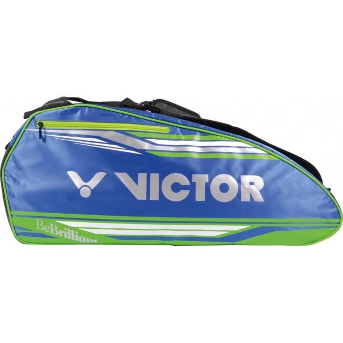 The Victor 9038 Multithermobag Green Badminton Racket Bag is a stylish blue and green sports bag, perfect for carrying rackets. It features "VICTOR" and "BeBrilliant" logos on the side, a sleek design with white accents, two top straps, and a convenient shoe compartment to accommodate multiple rackets.