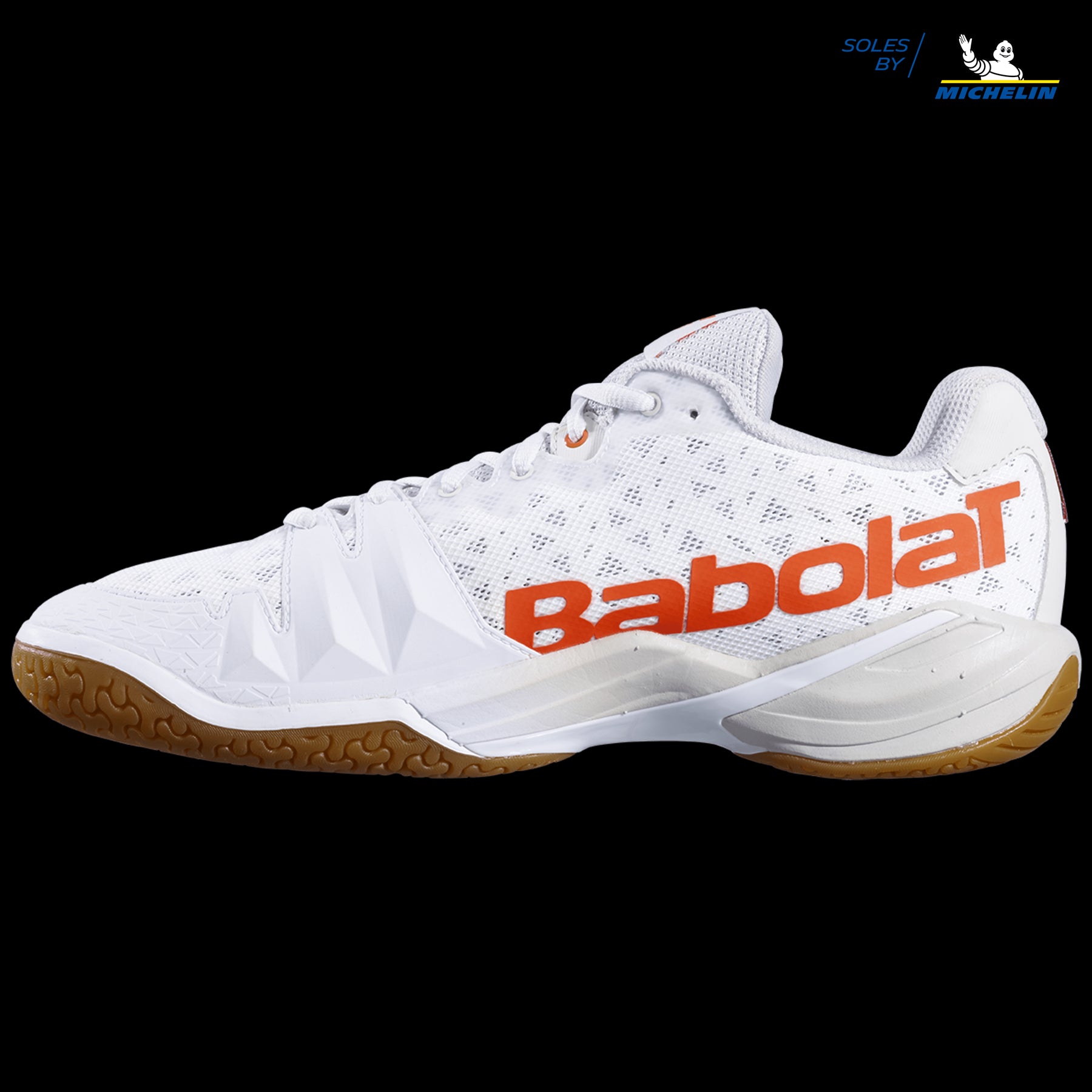 The Babolat Shadow Tour Badminton Shoes, in a sleek white and light grey design, incorporate advanced DCS technology with a bi-density sole to boost performance. Featuring a stylish textured pattern, these shoes are accented by the "Babolat" logo and bear the "Soles by Michelin" branding for added traction.