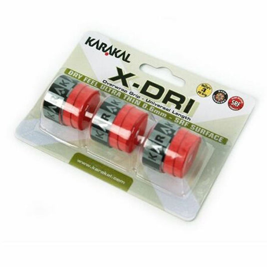 The Karakal X-Dri Overwrap Badminton Grip - Red comes in packaging featuring three red grips with black branding. Ideal for sports equipment, it offers "Dry Feel," is "Ultra Thin" at 0.6mm, and includes a non-slip grip improved by micro holes for enhanced performance.