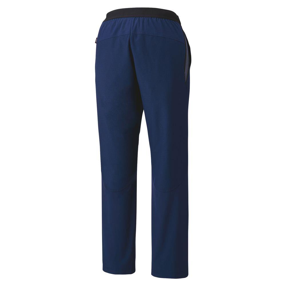 Rear view of Yonex 80090 Tracksuit Pants in navy blue, featuring an elastic waistband and black accents. The straight-leg design showcases subtle stitching details near the knees and is enhanced with ANTISTATIC properties for added comfort.