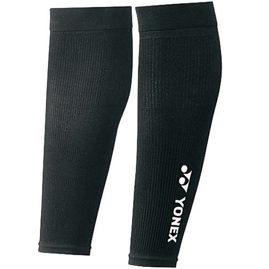 The Yonex STB-AC03 Black Badminton Leg Compression sleeves are designed with a ribbed texture for improved circulation and support, featuring the Yonex logo and text in white on one sleeve.