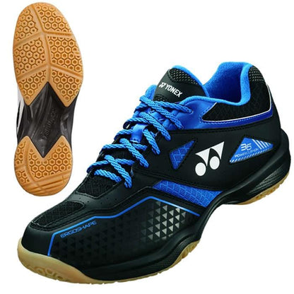 The Yonex Power Cushion 36 Men's Badminton Shoes feature a sleek black and blue design, adorned with the Yonex logo on the side and eye-catching blue laces. The shoes boast a brown sole with a visible grip pattern from the side view, and are distinguished by their ErgoShape design and "36" branding.