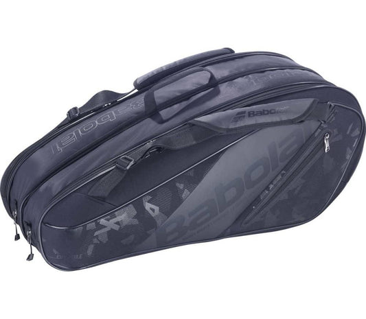 The stylish Babolat Expand Team 9 Racket Bag in black can hold up to nine rackets, offering a spacious zippered compartment and an easy-to-use shoulder strap. The Babolat logo is subtly embossed on the side, enhancing its contemporary, athletic look.