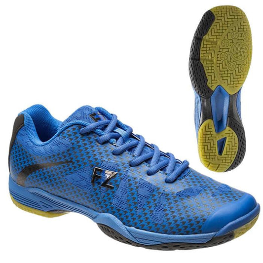 Introducing the FZ Forza Tamira M 2026 Olympian Blue Badminton Shoes: These shoes feature a blue and black design with textured patterns and an FZone Grip for superior traction, complemented by yellow accents on the sole. They have a lace-up design with a sleek "FZ" logo on the side. Above, you can see an image of the sole, highlighting its detailed tread pattern.