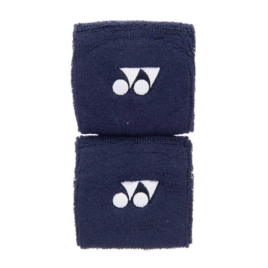 Two Yonex AC489EX Badminton Sweat Wristbands in a soft navy blue color, featuring a sweat-absorbing design and adorned with a white logo of stylized shapes, are placed side by side on a plain white background.