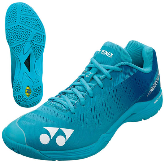 A pair of mint blue Yonex Power Cushion Aerus Z men's badminton shoes featuring the Yonex logo on both the toe cap and heel. These lightweight shoes boast a sleek design with a patterned outsole for enhanced grip and traction. One shoe is presented from the side, while the other highlights the sole design.