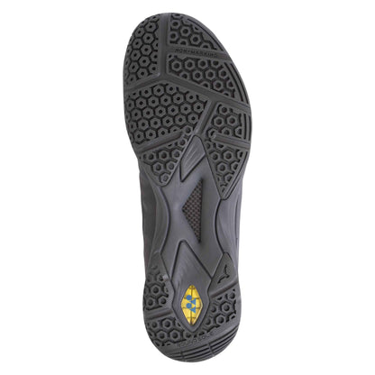 The image features the sole of a dark grey Yonex Power Cushion Aerus Z Men's Badminton Shoe with hexagonal and geometric patterns, a "non-marking" label, and a yellow logo positioned near the heel. The complex tread design of this shoe is textured to provide exceptional grip on the court.