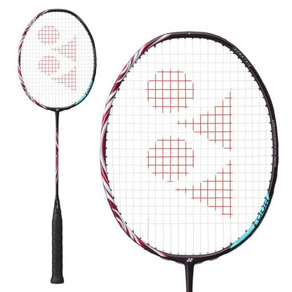 The image features a close-up of the Yonex Astrox 100 Tour 3U Kurenai Badminton Racket in red, highlighting its black handle and striking red accents. Designed for attacking play, this racket is characterized by its head-heavy balance. The white stringing is adorned with a distinctive red geometric logo at the center. The racket is depicted from two different angles against a plain white background.