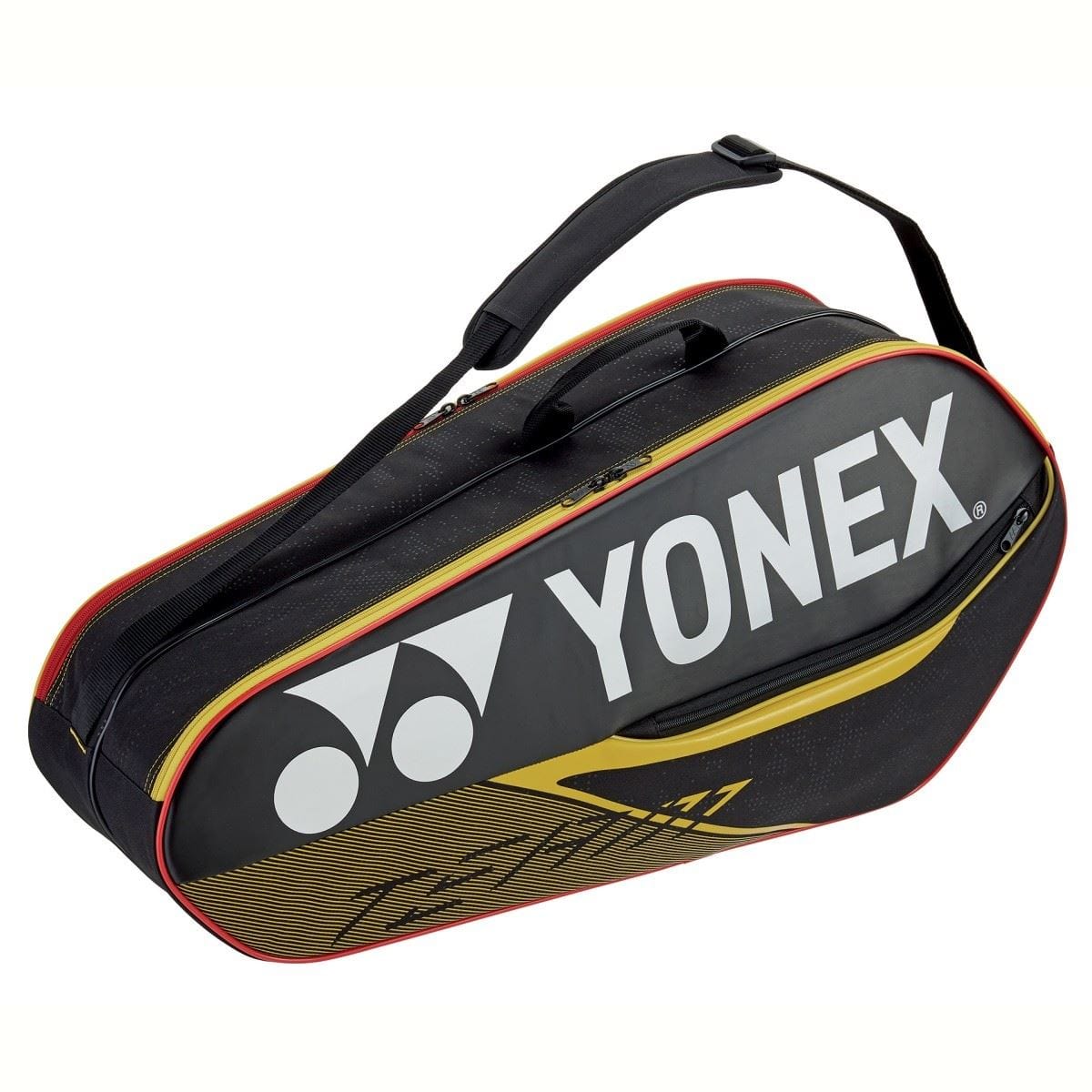 The Yonex 42026EX Team 6 Piece Badminton Racket Bag in black and yellow, embellished with a prominent Yonex logo and red accents, offers generous storage compartments for your gear. Its robust handle ensures convenient carrying, whether you’re heading to the court or storing it as a badminton racket bag.