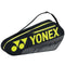 The Yonex 42123EX Team 3 Piece Badminton Racket Bag exhibits a stylish black design with striking yellow accents. Perfect for those who prefer to travel light, it comfortably accommodates up to three rackets. Equipped with a shoulder strap and a zippered compartment, the bag prominently features the iconic Yonex logo.