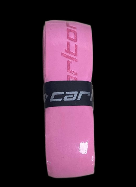 The Carlton PU Pro Badminton Grip in pink features white text and is partially covered by a black band with silver text, set against a black background. It's perfect for tennis or as a replacement grip for badminton.