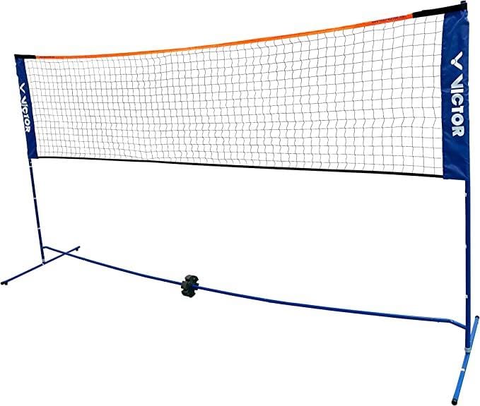 The Victor Mini Badminton Net boasts a blue frame and an orange-topped net, making it ideal for garden sports. Its net post construction is height adjustable, and the distinguished "Victor" branding appears prominently on the side panels against a white backdrop.