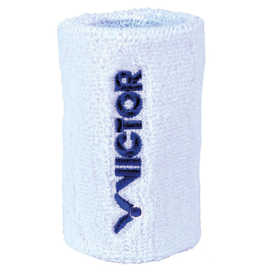 This Victor Badminton Wristband - White showcases the brand name "VICTOR" beautifully embroidered in blue, oriented vertically along its terry cloth center.