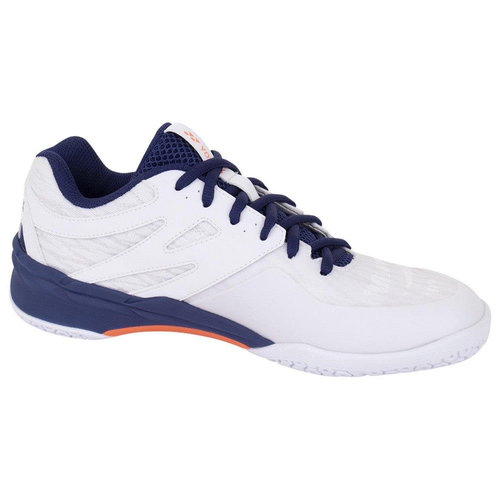 The Yonex Power Cushion 57 Men's Badminton Shoes come in a striking white with neon orange accents and feature blue laces, a blue tongue, and a navy heel. Equipped with Yonex's renowned Power Cushion technology for exceptional shock absorption, these shoes are ideal for badminton or casual wear. The sleek design is complemented by the primarily white sole with subtle neon orange detailing.