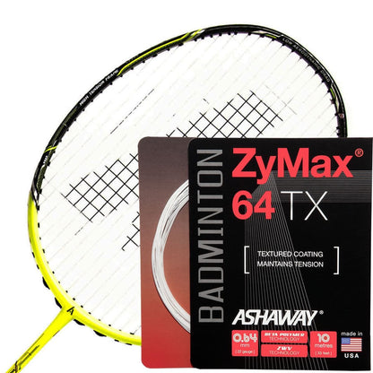 A yellow and black badminton racket equipped with Ashaway Zymax 64 TX Badminton String features a white string in a 0.64mm thickness and comes in a 10m packet. The packaging details the string's textured coating, tension maintenance, BETA polymer fibers, and highlights the advanced ZyWeave technology designed for optimal performance.