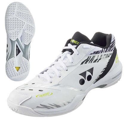 This limited edition Yonex Power Cushion 65Z3 Men's Badminton Shoe, known as the "White Tiger," showcases a sleek white design adorned with black and silver geometric patterns. It includes a textured sole for optimal grip, a lace-up system, and prominent Yonex branding on the side and tongue. The image emphasizes the detailed tread design, ensuring precision movements on the court.