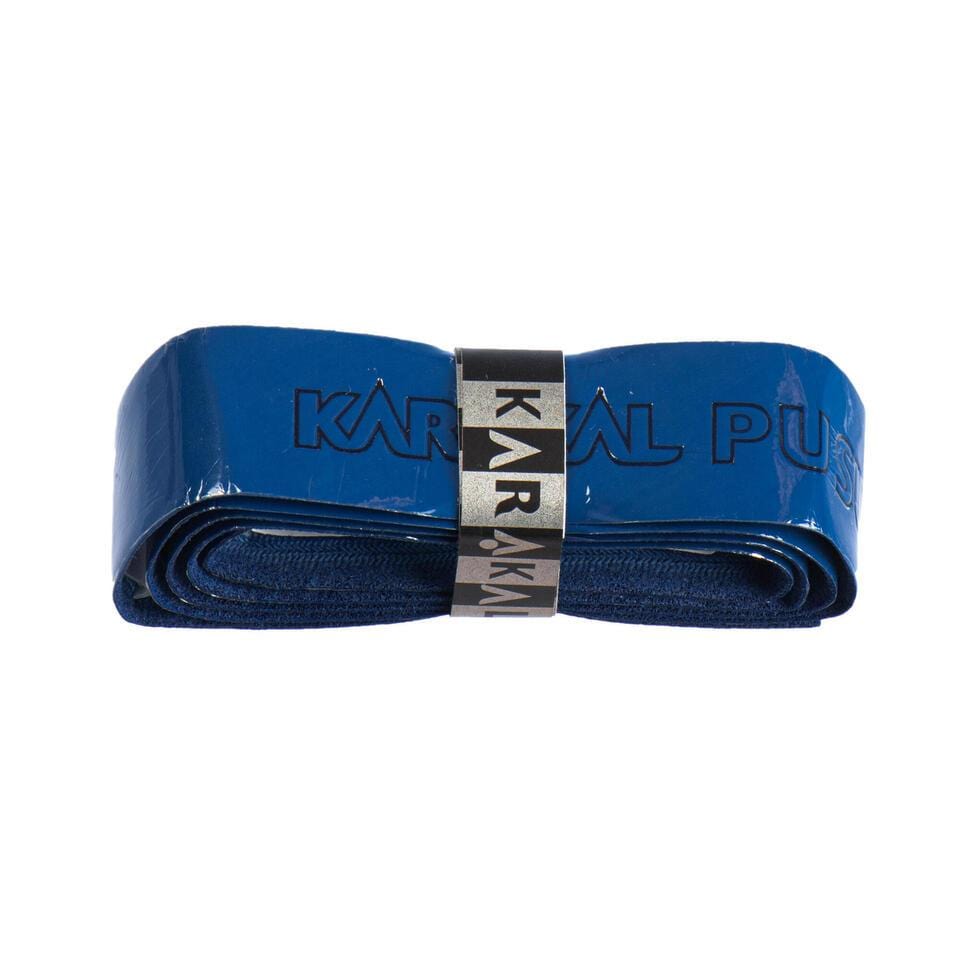 A rolled-up blue Karakal PU Badminton Super Grip Single for sports rackets, wrapped with a silver band displaying the brand name "Karakal.