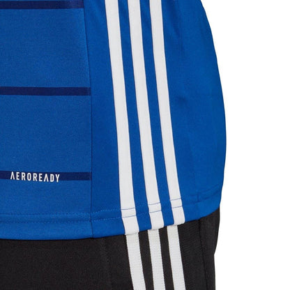 A close-up of the Adidas Campeon 21 Men's SS Jersey T-Shirt in royal blue, showcasing its white stripes and "AEROREADY" text. Crafted from recycled polyester, this adidas jersey is complemented by black shorts featuring similar white stripes along the sides.